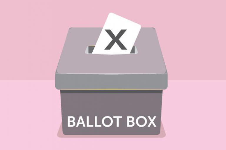 A graphic of a grey ballot box with a white ballot sticking out of the hole in the top, on a pink background